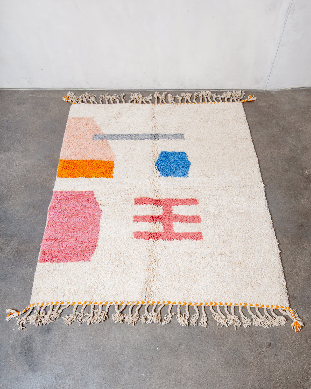 Modern, designer, handcrafted Berber rug from Morocco. Beniourain carpet with beautiful colours and patterns and fluffy wool texture.